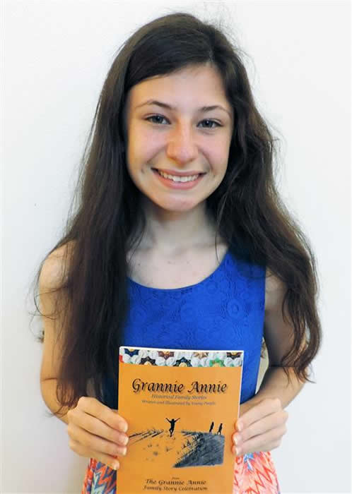 Grannie Annie published illustrator Grannie Annie published illustrator, holding a copy of Vol. 13, which features her artwork